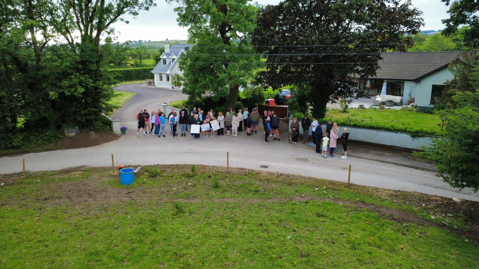 Overhead drone shot of residents gathered at Cotter's Gate